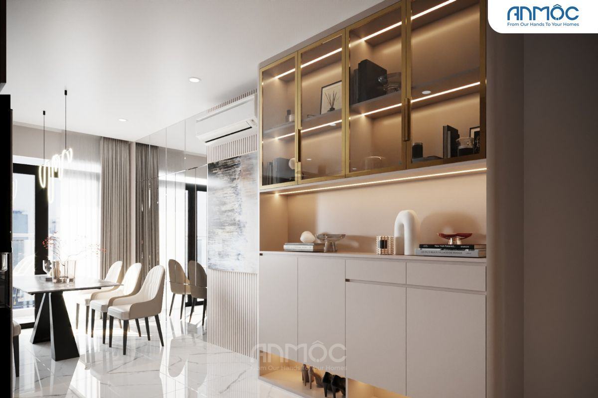 55+ Mẫu Thiết Kế Nội Thất Chung Cư "Đỉnh Nhất" 2026 2865 Góc nhìn từ cửa vào, tủ đựng đồ màu be và vàng kim, kết hợp kệ trang trí và hệ thống đèn led chiếu sáng, thể hiện sự sang trọng
